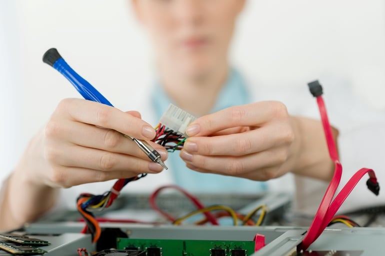 IT support engineer fixing computer